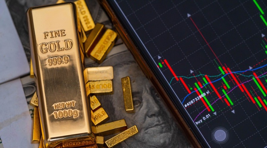 Are Trading Patterns In Europe Shifting? Lessons From The Gold Surge. Gold20Bars20Place20On20The20Phone20That20Opens20The20Candlestick20Chart.20And20Dollar Id